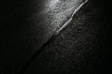 Black stripe on the asphalt.