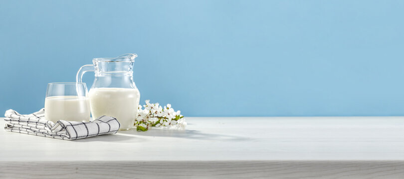 Fresh milk on white desk and blue background. 