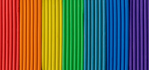 Beautiful background of colorful strips of plasticine. Rainbow background. Greeting card for Valentines Day, Mothers Day, Birthday, Womens Day