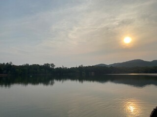 Lake view with copy space, sunset over mountain.