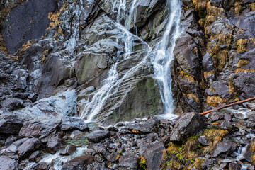 Fototapeta na wymiar Beautiful Waterfall Vallesinella in Madonna di Campiglio in the autumn time, National Park Adamello-Brenta Italy ,Trentino Dolomite Alps