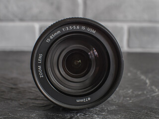 Canon lens with a focal length of 15-85mm F3, 5-5, 6 for the EF-S bayonet. Front view