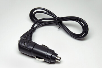 adapter for connecting an electrical appliance to car outlet. DSLR camera battery charger adapter
