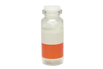 small glass bottle of medicines with two-color label, plastic lapped stopper, empty, with cotton absorbent inside
