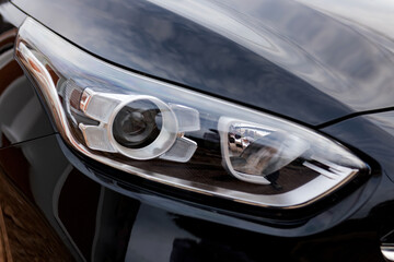 Obraz na płótnie Canvas Close up detail on one of the LED headlights modern car.