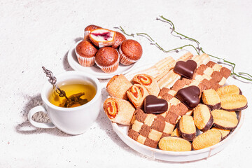 Good mood morning tea with various cookies and muffins