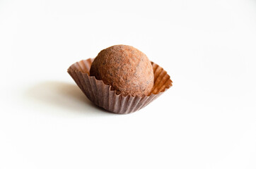 Chocolate truffle candy on white background.