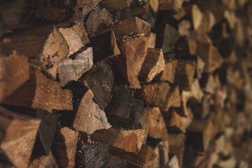 Winter preparation. Stacking Firewood. Pile of firewood loggs. Firewood background.