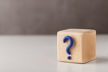 Question mark on wooden cube block