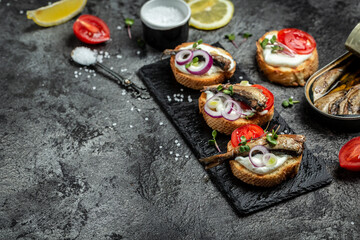 Sandwich with sprats. Sprat in oil, Danish cuisine. banner, menu recipe place for text, top view