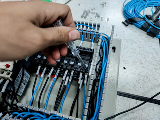 Assembling the control cabinet, control cabinet controlling the electrical system in the power plant