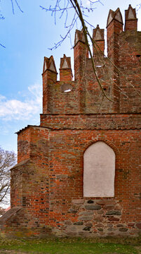 Architectural details of the temple in close-up. A tower, a belfry built in the 19th century to the facade of St. John's Church in the village of Czerniki in Masuria, Poland. Currently a historic buil