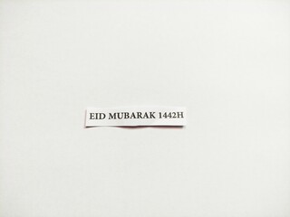 a small white piece of paper inscribed on muslim celebration day