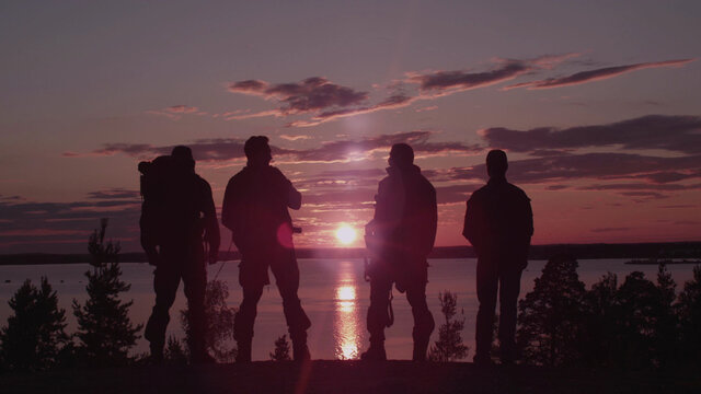 Men With Guns at Sunset. Shot with Red Camera