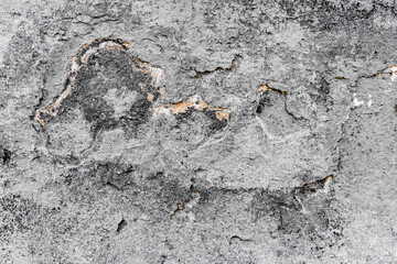 Texture of a concrete wall with cracks and scratches which can be used as a background