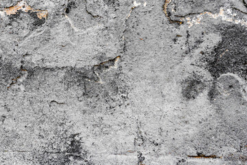 Texture of a concrete wall with cracks and scratches which can be used as a background