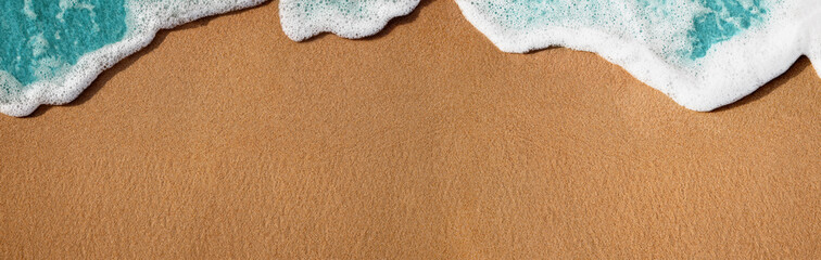 Empty Sand Beach and Soft Blue Wave on Summer Sunny Day. Natural Texture Background. Wide and Long Size for Copy Space. Top View. Focus on Sand