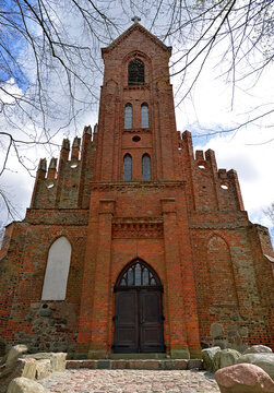 Architectural details of the temple in close-up. A tower, a belfry built in the 19th century to the facade of St. John's Church in the village of Czerniki in Masuria, Poland. Currently a historic buil