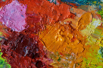 Multicolored oil paint texture macro photography. The artist's palette after a long work, a...