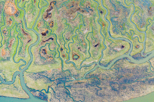 Aerial view of the abstract pattern made by Scheldt river estuaries near Belgium and The Netherlands border, Nieuw-Namen, Zeeland, The Netherlands.