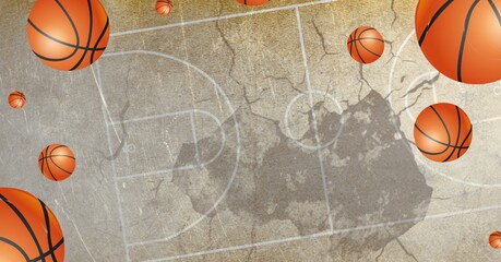 Composition of multiple basketballs in air over basketball court cracked distressed surface