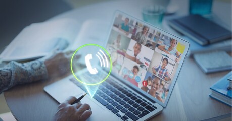 Composition of digital interface with call icon over businessman on laptop video call
