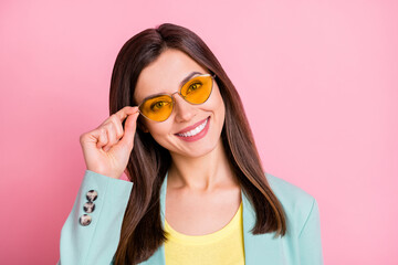 Photo portrait of cool pretty girl wearing glasses isolated on pastel pink colored background