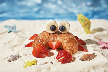 Cute crab croissant with fruit for kids breakfast