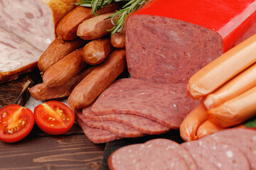 Variety of meat and sausage products on table