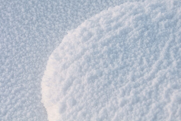 Beautiful texture of snow. Beautiful sunlight shows the texture and details of the snow