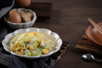 Taiwanese homemade local food of scrambled eggs with loofah gourd and sesame oil.