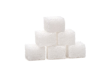 Sugar cubes on one another, isolated on white background.