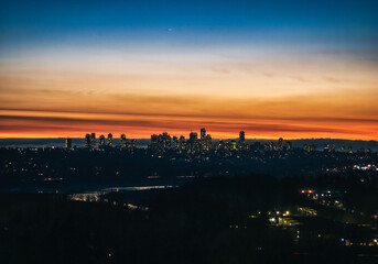 Fototapeta na wymiar City of Metrotown on sunset sky background in Vancouver, British Columbia