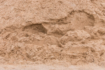 Pile of sand texture background at construction site, close-up