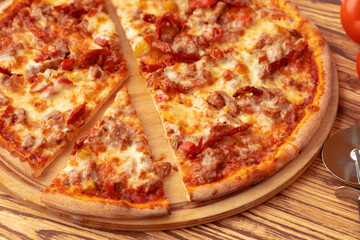 Freshly baked pizza on table close up