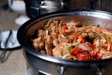 spicy sausage pau de angu served in a pan