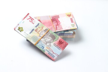 Random Layout Photo Rupiah Paper Money, 10000, 50000, 100000 and 75000 at White Background