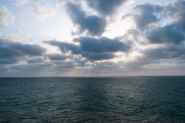 Naklejka na ściany i meble clouds over the sea with sun Arabian sea, Gwadar pakistan