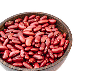 Kidney beans in wooden bowl on white background, copy space