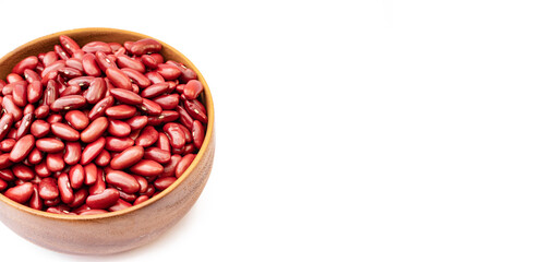 Kidney beans in wooden bowl on white background, copy space