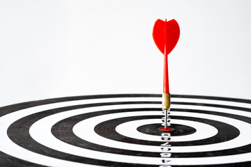 Bullseye is a target of business. Dart is an opportunity and Dartboard is the target and goal. challenge in business marketing as concept. White background