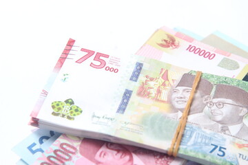 Abstract Random Layout Photo Rupiah Paper Money, 10000, 50000, 100000 and 75000 at White Background
