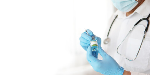 Close up of doctor holding vaccine and syringe, concept of medical, coronavirus vaccine, covid-19 vaccine.