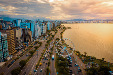 aerial image with drone on the seashore at sunset in florianópolis Santa Catarina with the ferris...