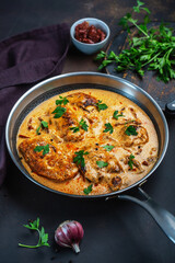 Cajun chicken in a creamy sauce prepared in a pan