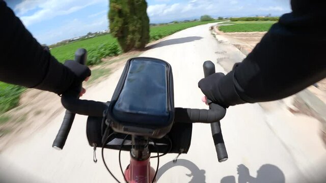 Point of view of a gravel cyclist biker riding in countryside