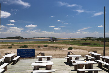 Translation: Garzon lagoon crossing raft - Hours: summer 6 am to 10 pm - winter 8 am to 12 pm and 2 pm to 6 pm