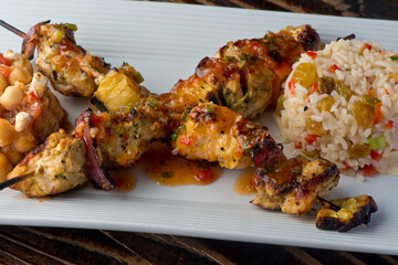 Chicken Kabobs. Cubes of grilled chicken, grilled vegetables, onions bell peppers and seasoned with garlic and spices. Served with rice, traditional classic Greek or Italian restaurant favorite. 