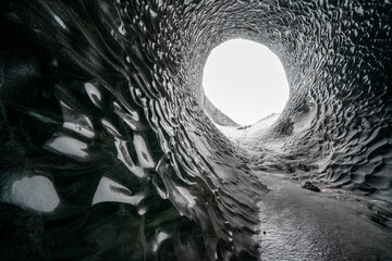 Dark blue glacier cave in Iceland