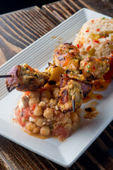 Chicken Kabobs. Cubes of grilled chicken, grilled vegetables, onions bell peppers and seasoned with garlic and spices. Served with rice, traditional classic Greek or Italian restaurant favorite. 
